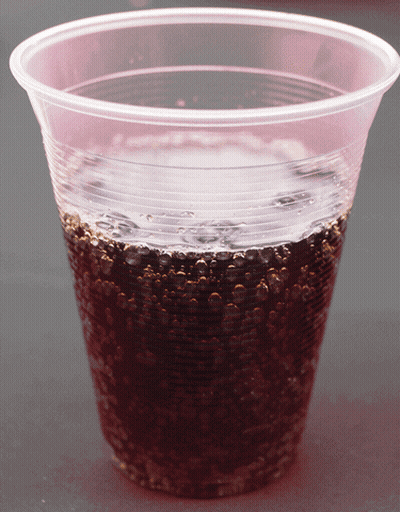 Clear Plastic Cup With Dark Liquid GIF