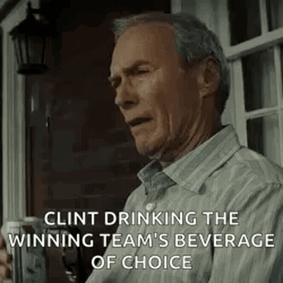 Clint Eastwood Is Drinking The Winning Team 'S Beverage Of Choice While Sitting On A Porch . GIF