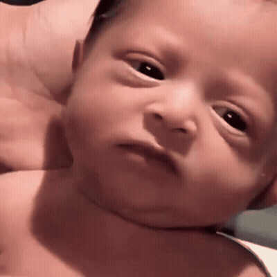 Close Up Baby Serious Face GIF