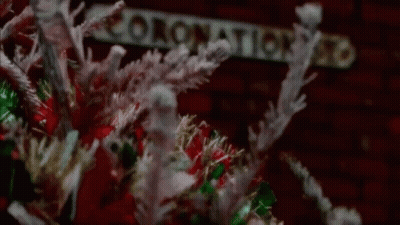 Close Up Christmas Wreath With Sign GIF