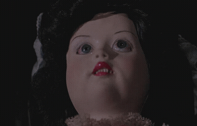 Close-Up Doll Face With Black Hair And Pink Lips GIF
