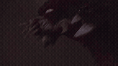Close Up Face In Dark Room GIF