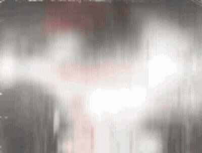Close-Up Face In Dark Room With Smoke GIF