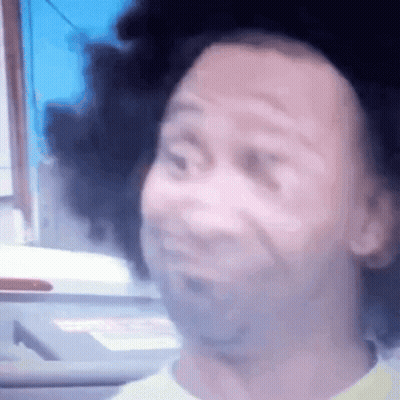 Close Up Face On Blue Background GIF