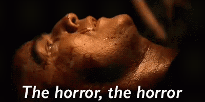 Close Up Face Saying The Horror The Horror GIF