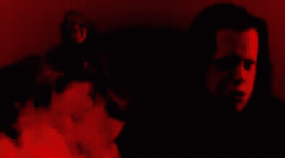 Close Up Face Surrounded By Flames GIF