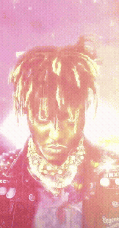 Close-Up Face With Dreadlocks And Necklace GIF