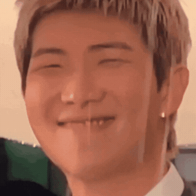 Close-Up Face With Eyes Closed And Missing Tooth GIF