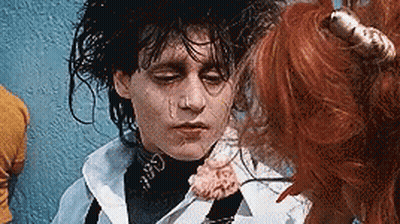Close Up Face With Flower In Mouth GIF