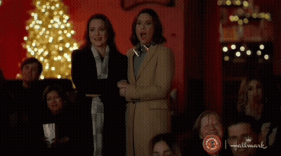 Close Up Face With Purple Lights Behind GIF