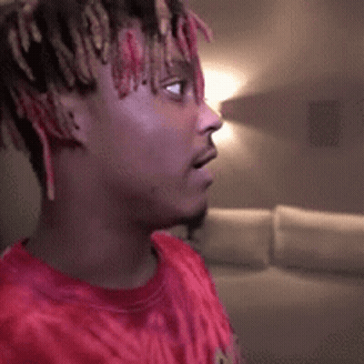 Close-Up Face With Red Exit Sign GIF