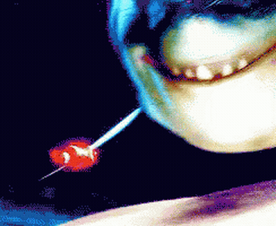 Close Up Face With Red Lollipop GIF