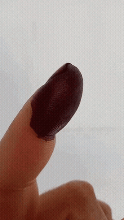 Close Up Finger With Black Paint GIF