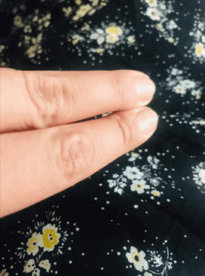 Close Up Fingers Black Floral Background GIF