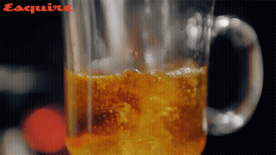 Close Up Glass With Esquire On Bottom GIF