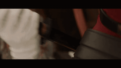 Close Up Hand Holding Knife In Dark Room GIF