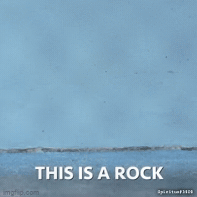 Close-Up Hand Holding Potato This Is A Rock GIF