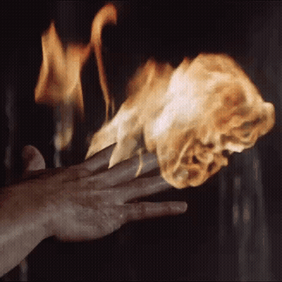 Close Up Hand Holding Torch In Dark Room GIF