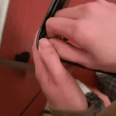 Close Up Hands Holding Black Object GIF