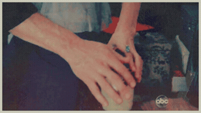Close-Up Hands With ABC Logo Background GIF