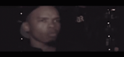 Close Up Man Face Dark Room Lights Behind GIF