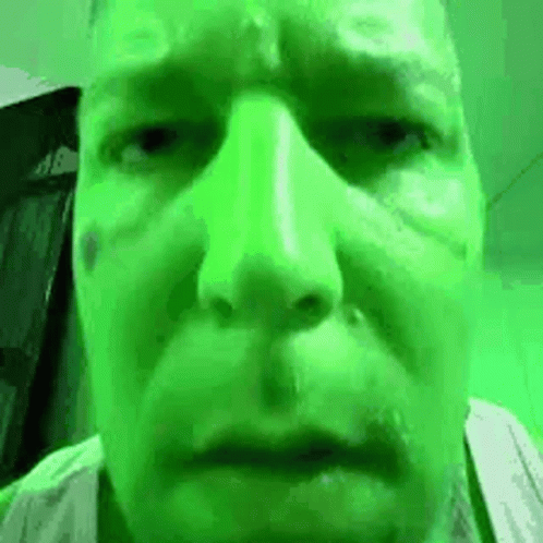 Close Up Man Face Green Background GIF