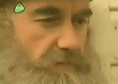 Close Up Man Face With Green Sticker GIF