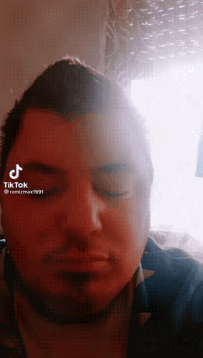 Close Up Man Face With TikTok Watermark GIF