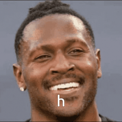 Close Up Man In Sunglasses Smiling With Letter H GIF