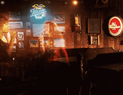 Close Up Man's Face With Red Light In Dark Room GIF