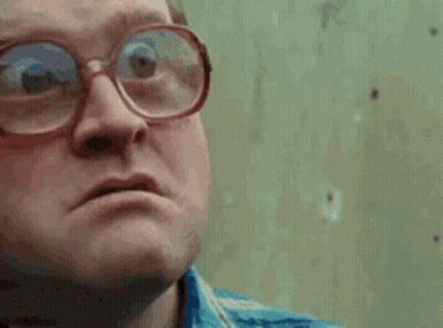 Close Up Man Wearing Glasses Making A Face GIF