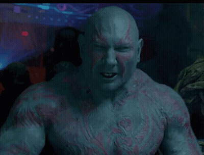Close Up Man With Beard And Chest Tattoos GIF