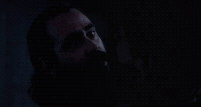 Close Up Man With Beard In The Dark GIF