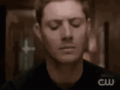 Close Up Man With Eyes Closed In Dark Room GIF