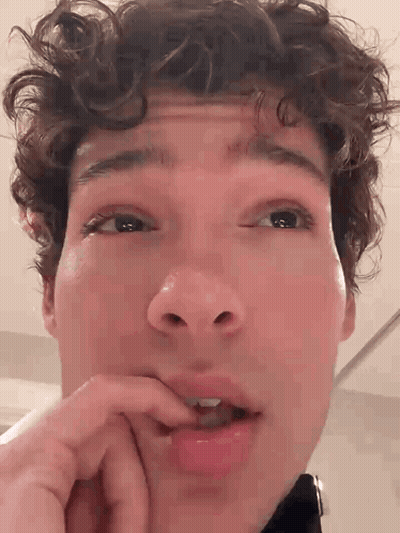 Close Up Man With Hand On Mouth GIF