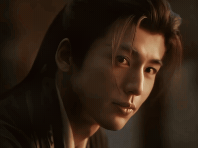 Close-Up Man With Long Hair Looking At Camera GIF