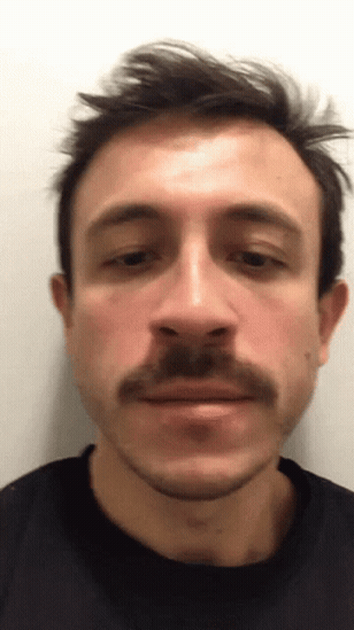 Close Up Man With Mustache In Black Shirt GIF