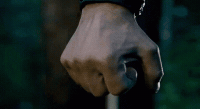 Close Up Of A Fist Against Dark Background GIF