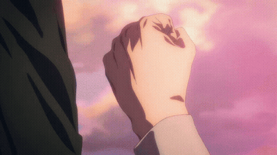 Close Up Of A Fist Against Pink Background GIF