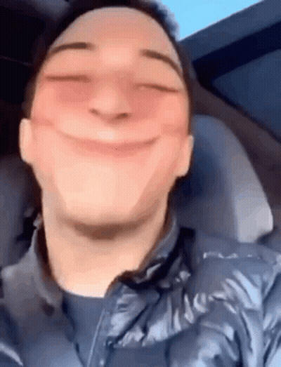 Close Up Of A Man Making Funny Face In A Car GIF