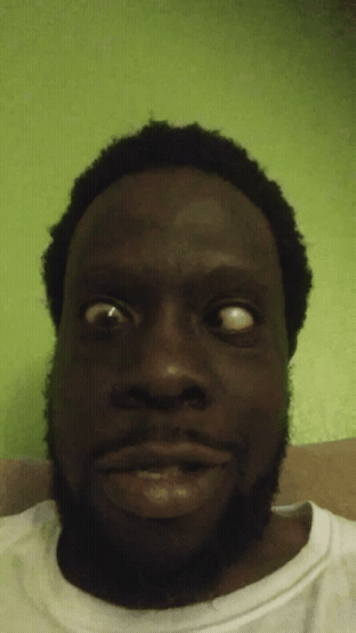 Close Up Of A Man's Face On Green Background GIF