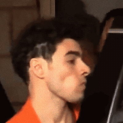 Close Up Of A Man's Face With Black Background GIF