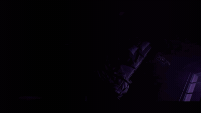 Close-Up Of A Woman's Eyes With Dark Background GIF