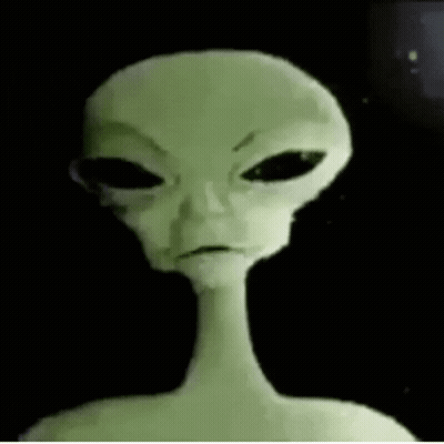 Close Up Of Alien Face With Black Eyes GIF
