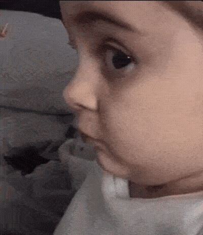 Close Up Of Baby Face Looking GIF