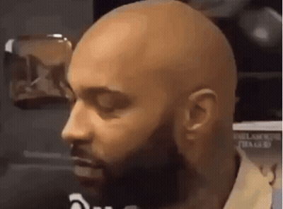 Close-Up Of Bald Bearded Man GIF