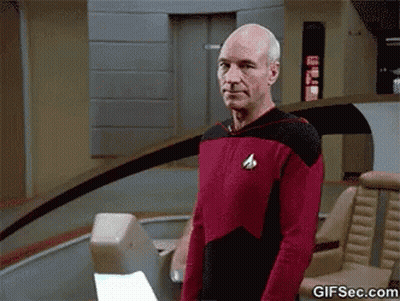 Close Up Of Bald Man Face Dark Background GIF