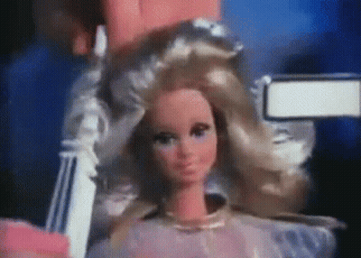 Close Up Of Barbie Doll Being Held GIF