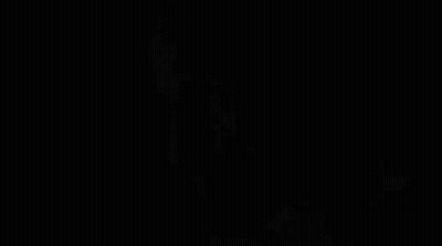 Close Up Of Bearded Man In Dark GIF