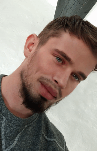 Close Up Of Bearded Man With Blue Eyes GIF